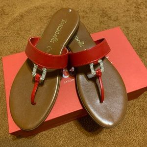 Women’s red flat sandals.